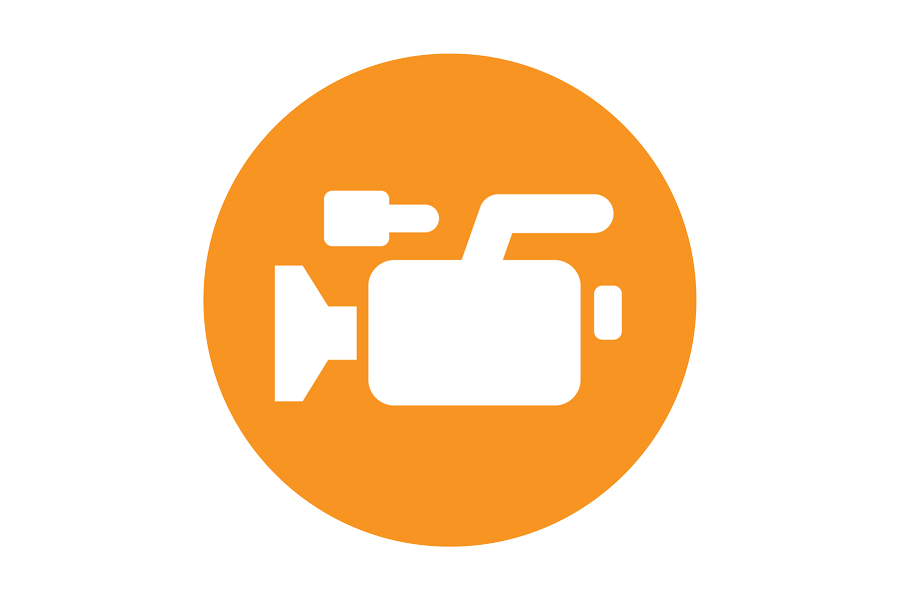 White video camera on orange background